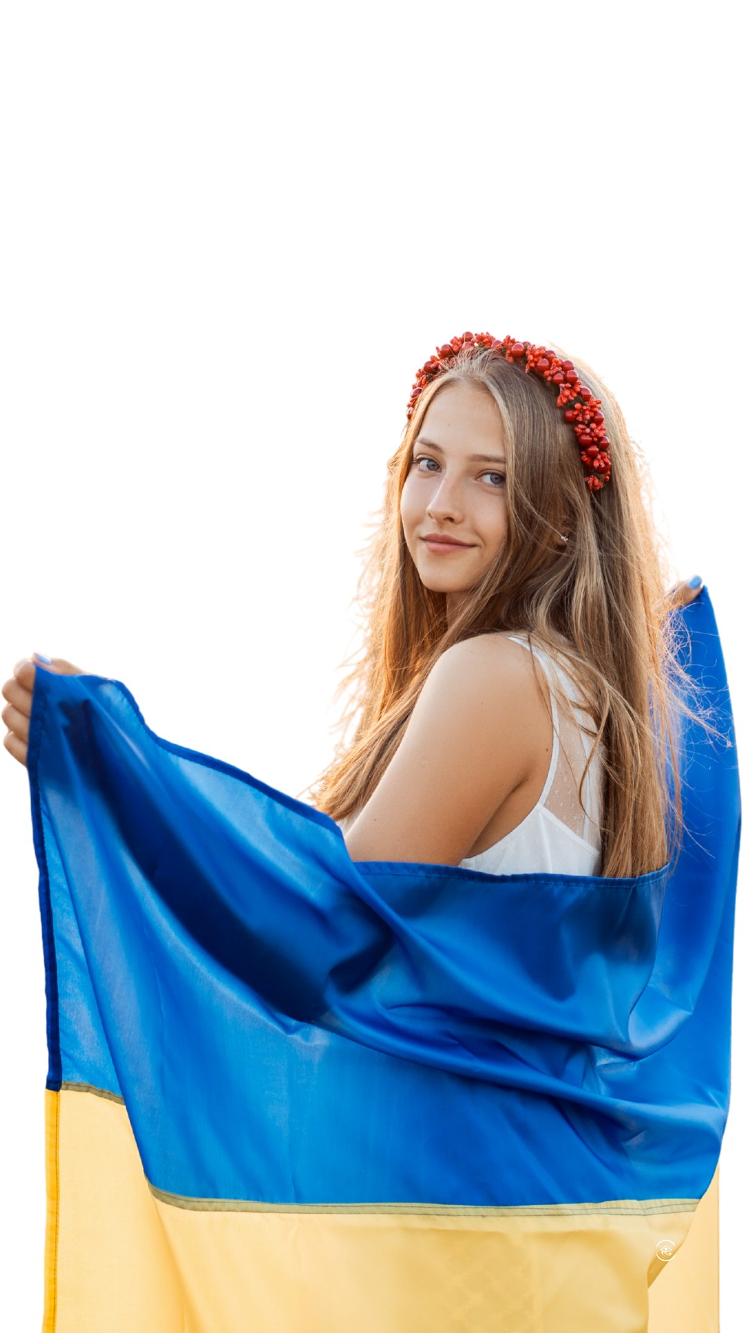 A young Ukrainian woman wrapped in the national flag
